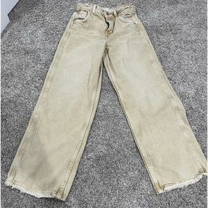 Brown straight leg Zara jeans.